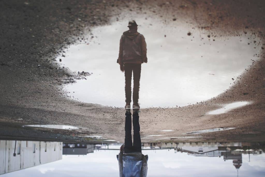 Upside Down Reflection of a Man in a Puddle - Stranger Things