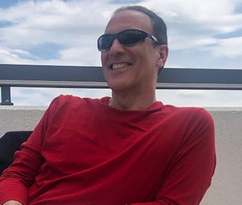 Tedd Drattell smiling wearing sunglasses outdoors