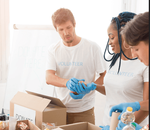 Volunteers packing up donation boxes.