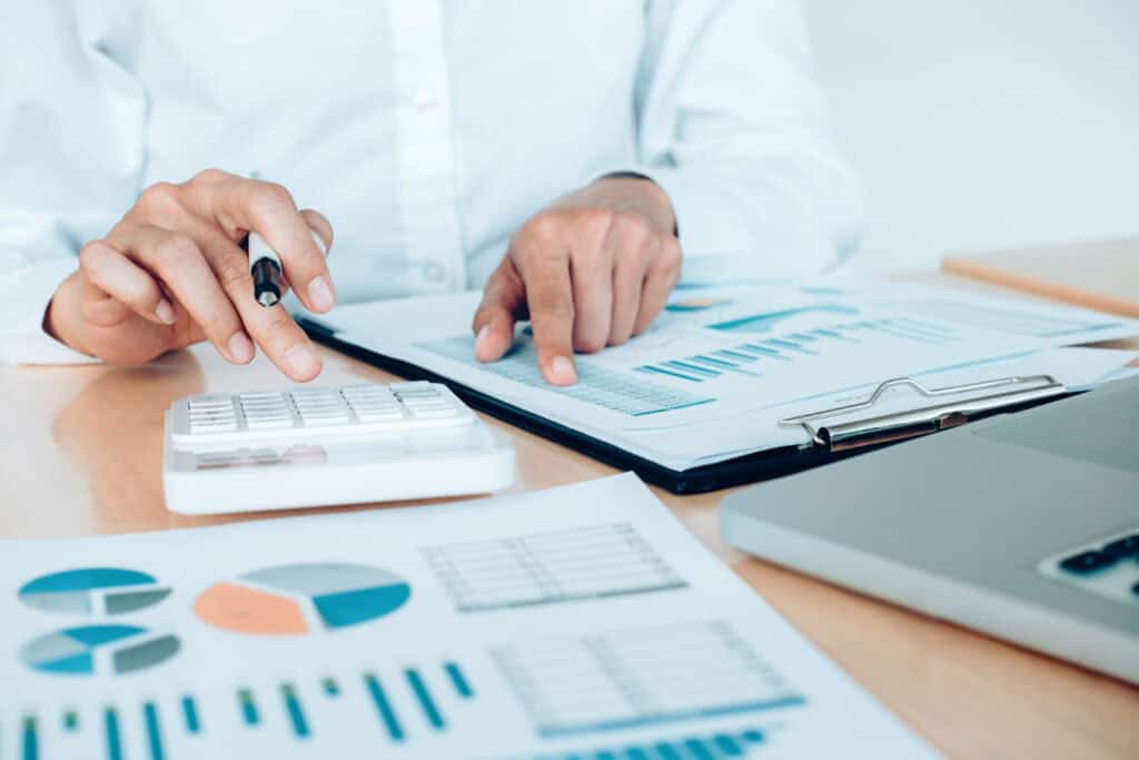 Business women analyzing data on charts