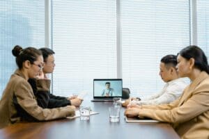 Business People in a Meeting with a Fractional CFO Via Video Call