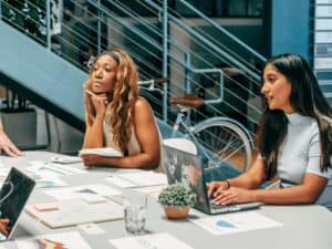 Two Women Listening to Accounting Tips