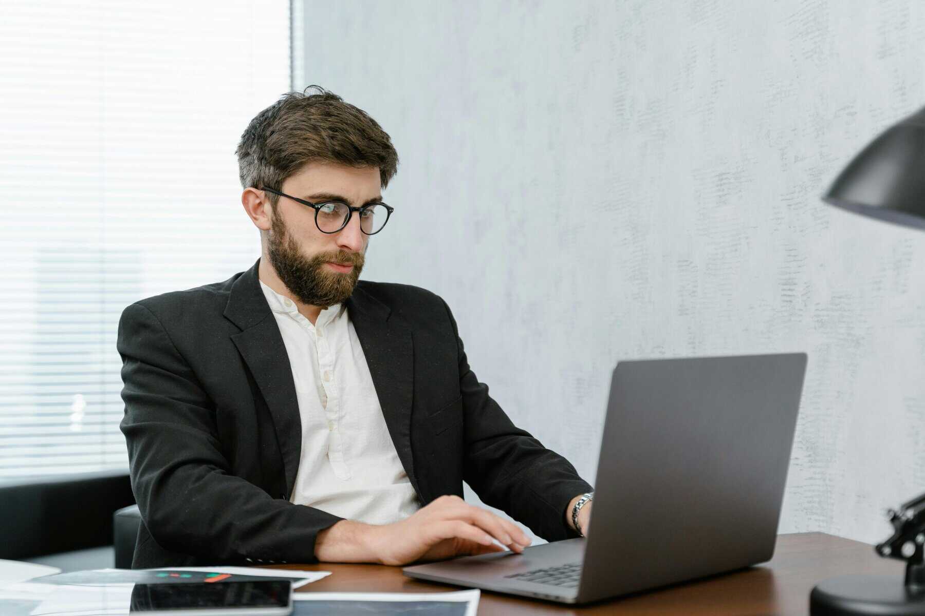 A Fractional Finance Director Using Laptop on a Table